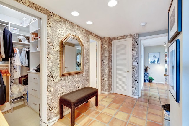 hallway featuring light tile patterned floors