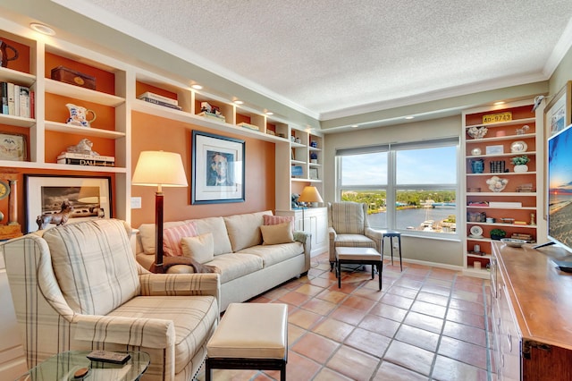 sitting room with a textured ceiling, light tile patterned flooring, and crown molding