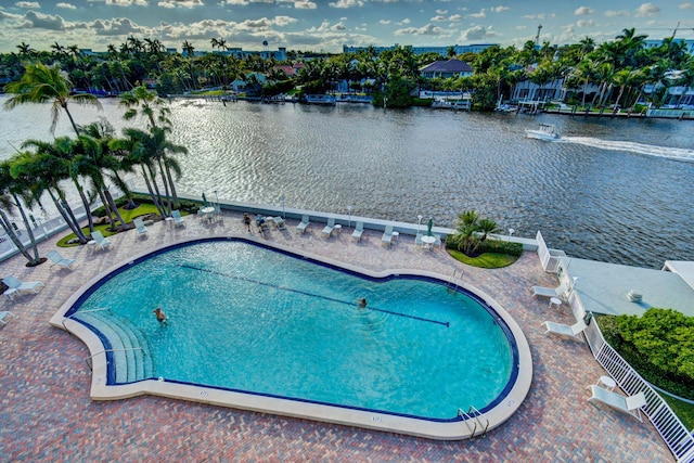 view of swimming pool with a water view