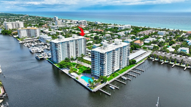 birds eye view of property with a water view