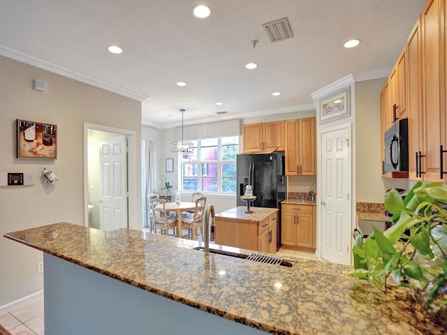 kitchen with black appliances, crown molding, dark stone countertops, and sink