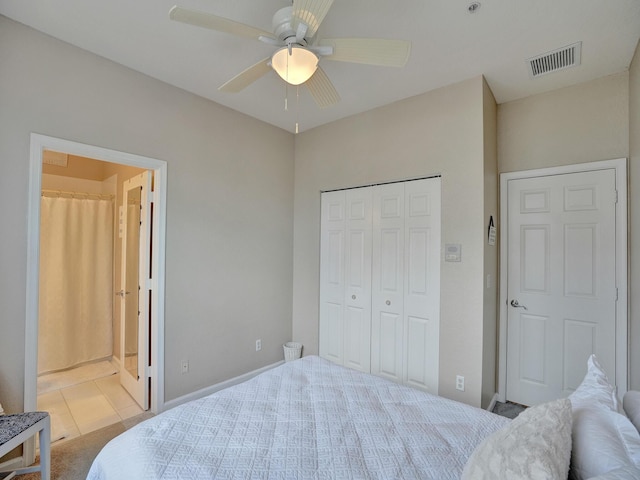 bedroom featuring light carpet, a closet, and ceiling fan