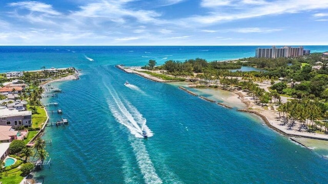 birds eye view of property featuring a view of the beach and a water view