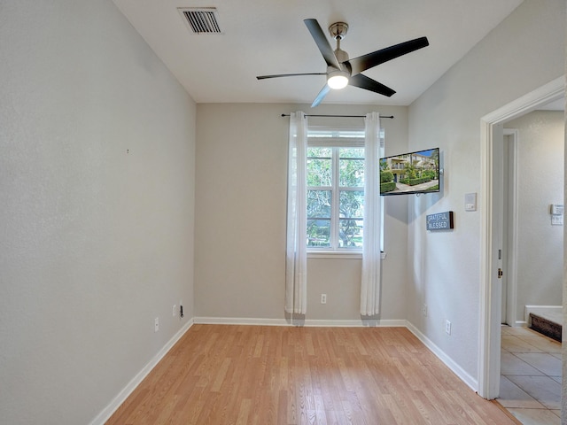 unfurnished room featuring ceiling fan and light hardwood / wood-style floors