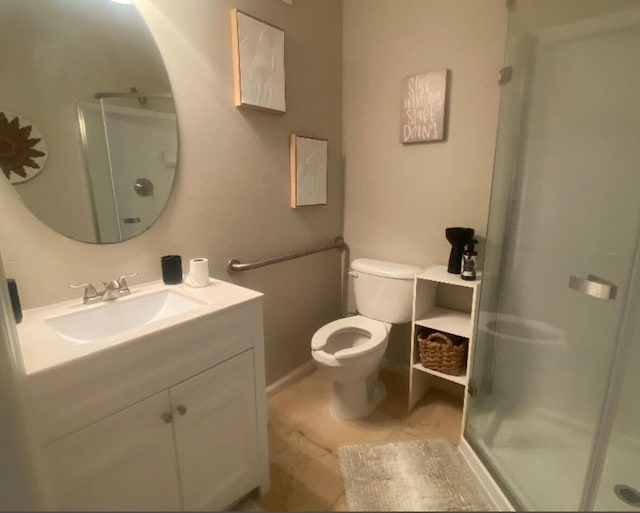 bathroom featuring tile patterned floors, vanity, an enclosed shower, and toilet