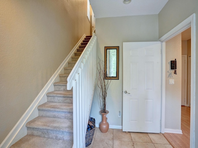 stairs with wood-type flooring