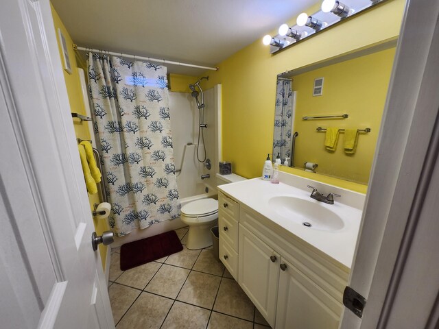 full bathroom featuring tile patterned floors, vanity, shower / bathtub combination with curtain, and toilet