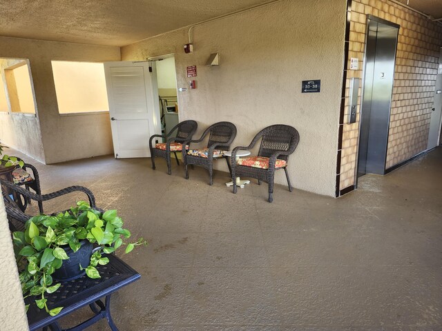 view of patio with elevator