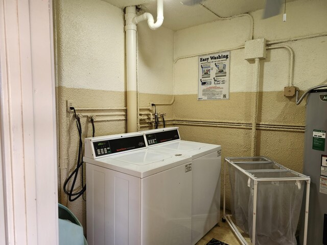 washroom with washer and dryer and electric water heater