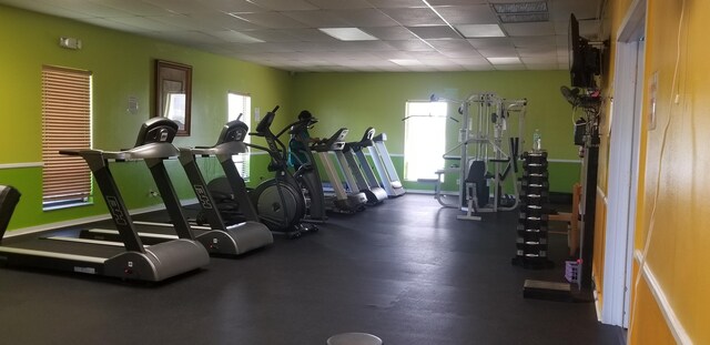 workout area with a paneled ceiling