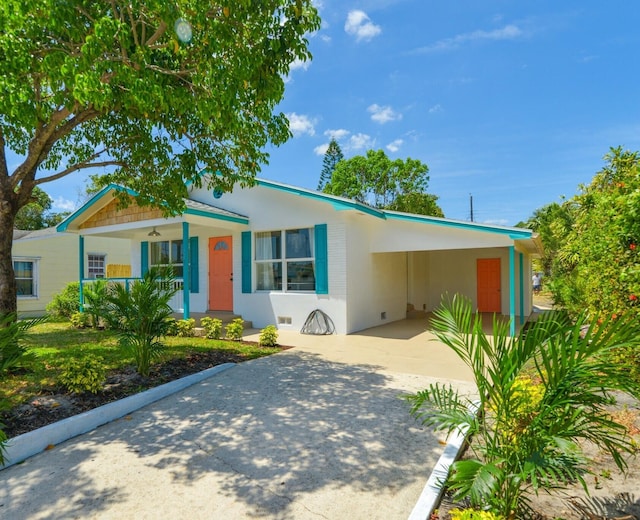 view of front of house with a carport