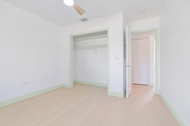 unfurnished bedroom featuring a closet, ceiling fan, and light hardwood / wood-style floors