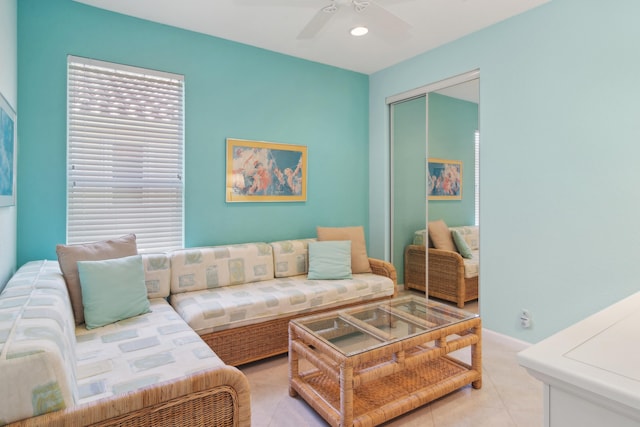 living room featuring ceiling fan and light tile floors