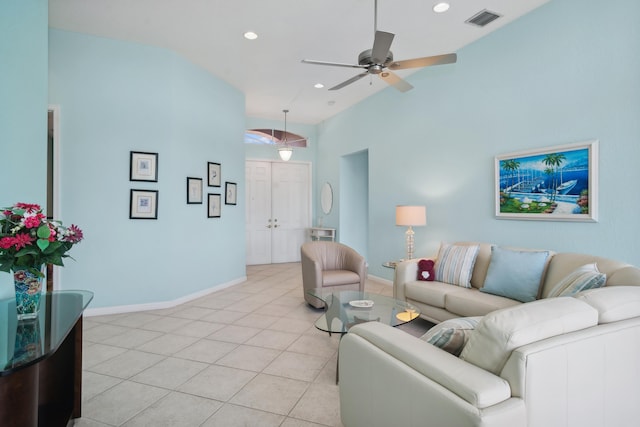 tiled living room featuring vaulted ceiling and ceiling fan