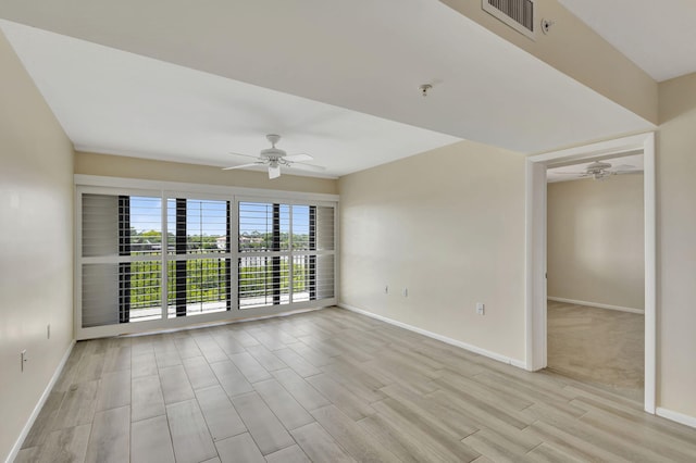 unfurnished room featuring ceiling fan and light wood-type flooring