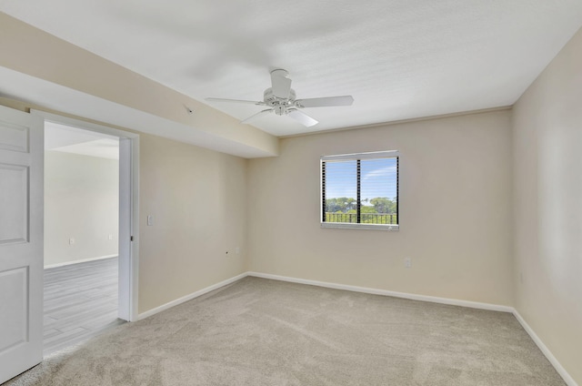 unfurnished room with ceiling fan and carpet floors