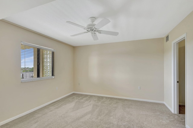 unfurnished room with carpet floors and ceiling fan