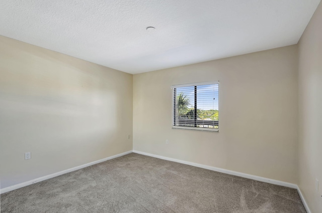 unfurnished room featuring carpet floors