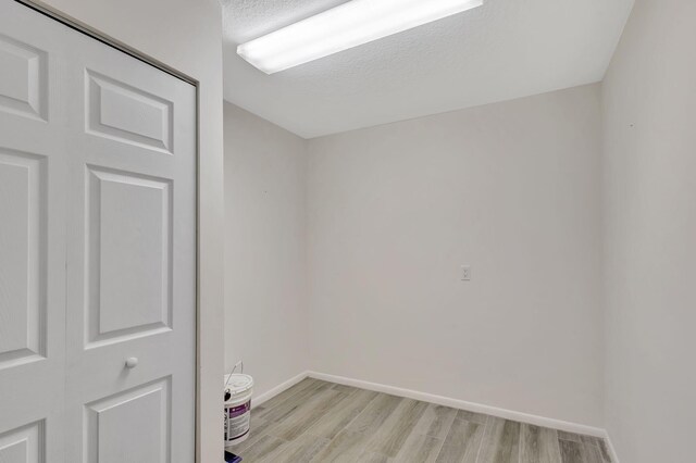 spare room with light wood-type flooring