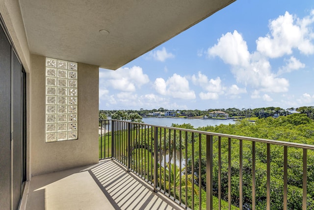 balcony featuring a water view