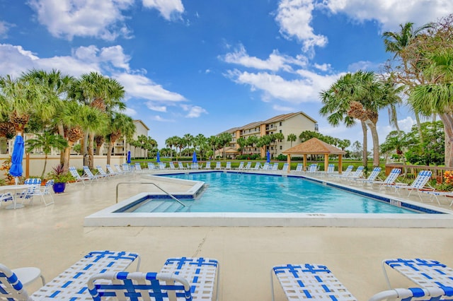 view of swimming pool with a patio and a gazebo