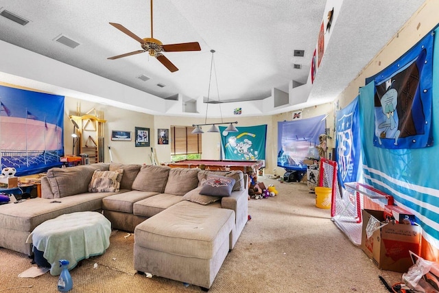 living room with a textured ceiling, carpet, ceiling fan, and pool table