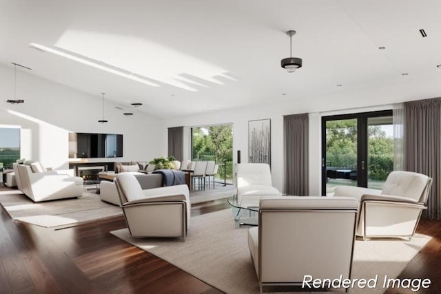 living room featuring a healthy amount of sunlight, lofted ceiling, and dark hardwood / wood-style floors