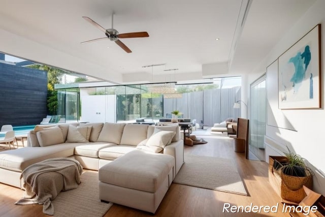 living room featuring light hardwood / wood-style floors and ceiling fan