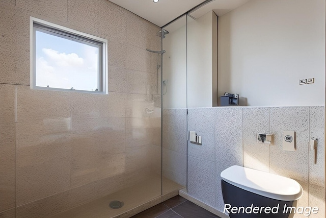 bathroom featuring a tile shower, tile flooring, tile walls, and toilet