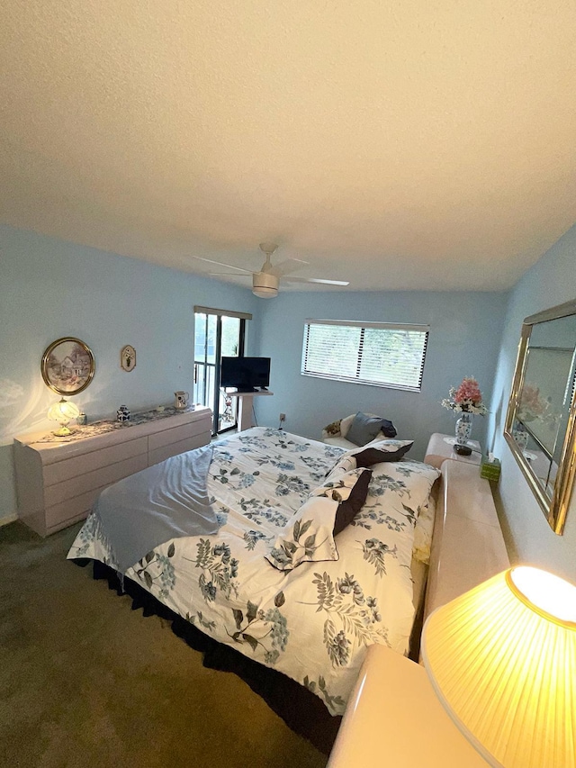 bedroom featuring ceiling fan, carpet, and multiple windows