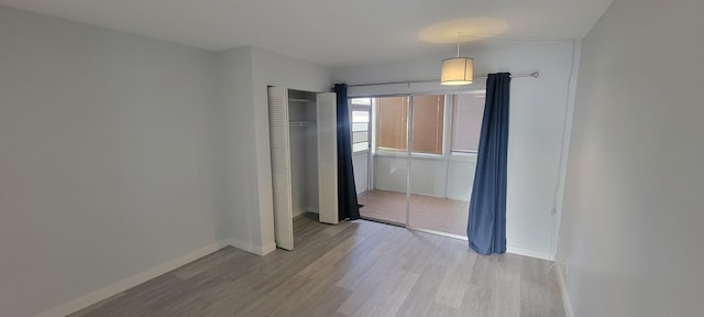 dining space featuring wood-type flooring