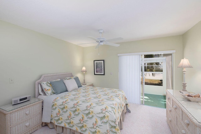 carpeted bedroom with ceiling fan and access to outside