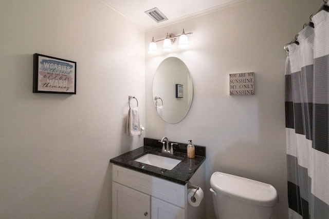 bathroom featuring a shower with curtain, crown molding, vanity, and toilet