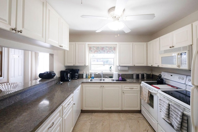 kitchen with white cabinets, ceiling fan, white appliances, and sink