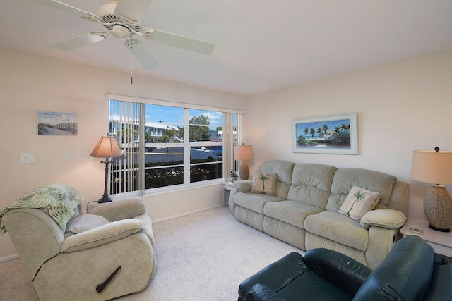 carpeted living room featuring ceiling fan