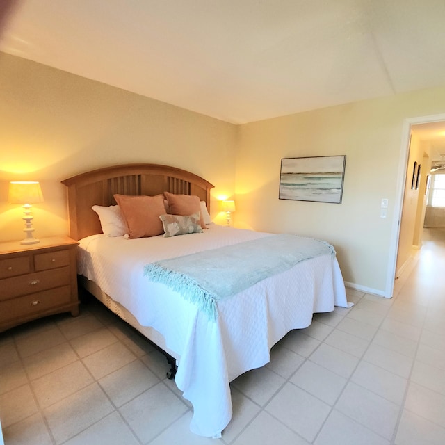 bedroom with light tile patterned floors