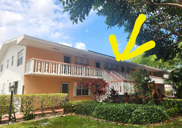 rear view of house with a balcony