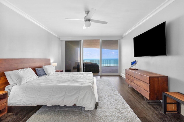 bedroom with crown molding, dark wood-type flooring, access to exterior, a water view, and ceiling fan