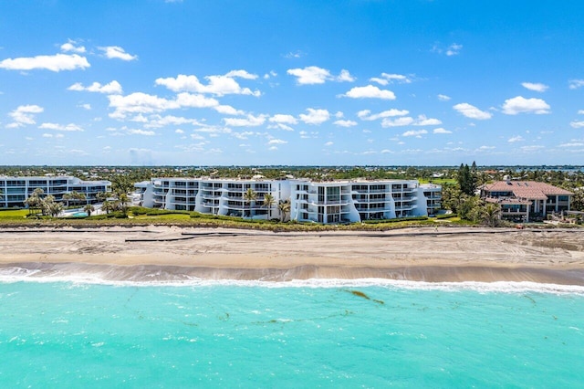 exterior space featuring a water view and a view of the beach