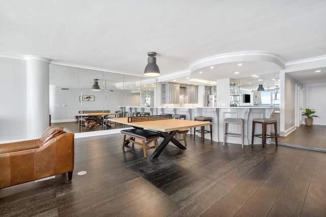 game room with ornamental molding and dark hardwood / wood-style floors