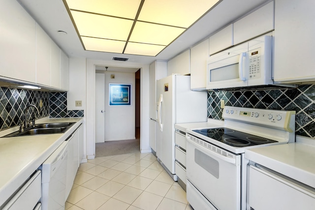 kitchen featuring white cabinets, white appliances, tasteful backsplash, and sink