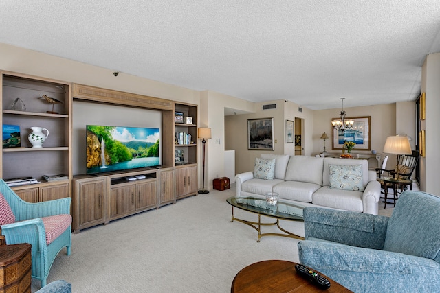 carpeted living room with a textured ceiling and a chandelier