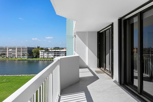 balcony featuring a water view