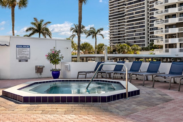 view of pool featuring a community hot tub