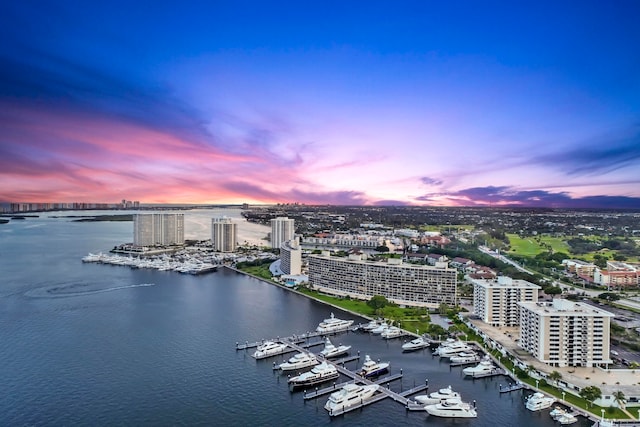 aerial view at dusk with a water view