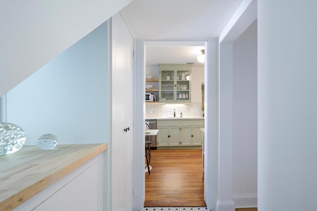 hall featuring sink and light hardwood / wood-style flooring