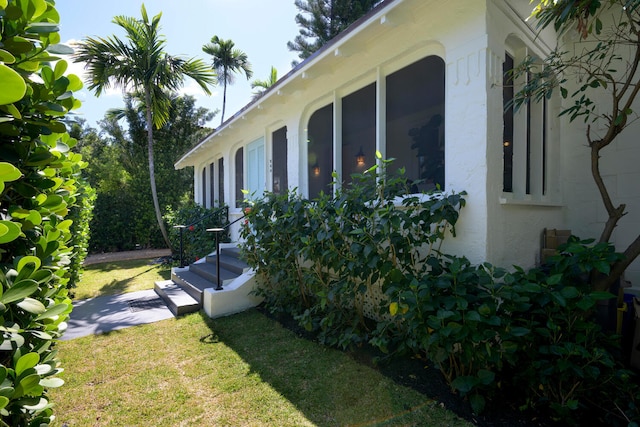 view of yard with a sunroom