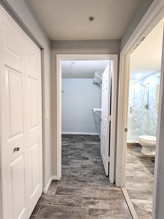 corridor with dark wood-type flooring