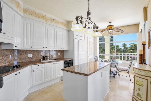 kitchen featuring tasteful backsplash, decorative light fixtures, white cabinetry, and light tile floors