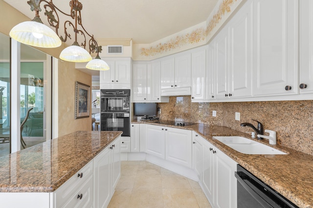 kitchen featuring white cabinets, black appliances, sink, tasteful backsplash, and dark stone counters